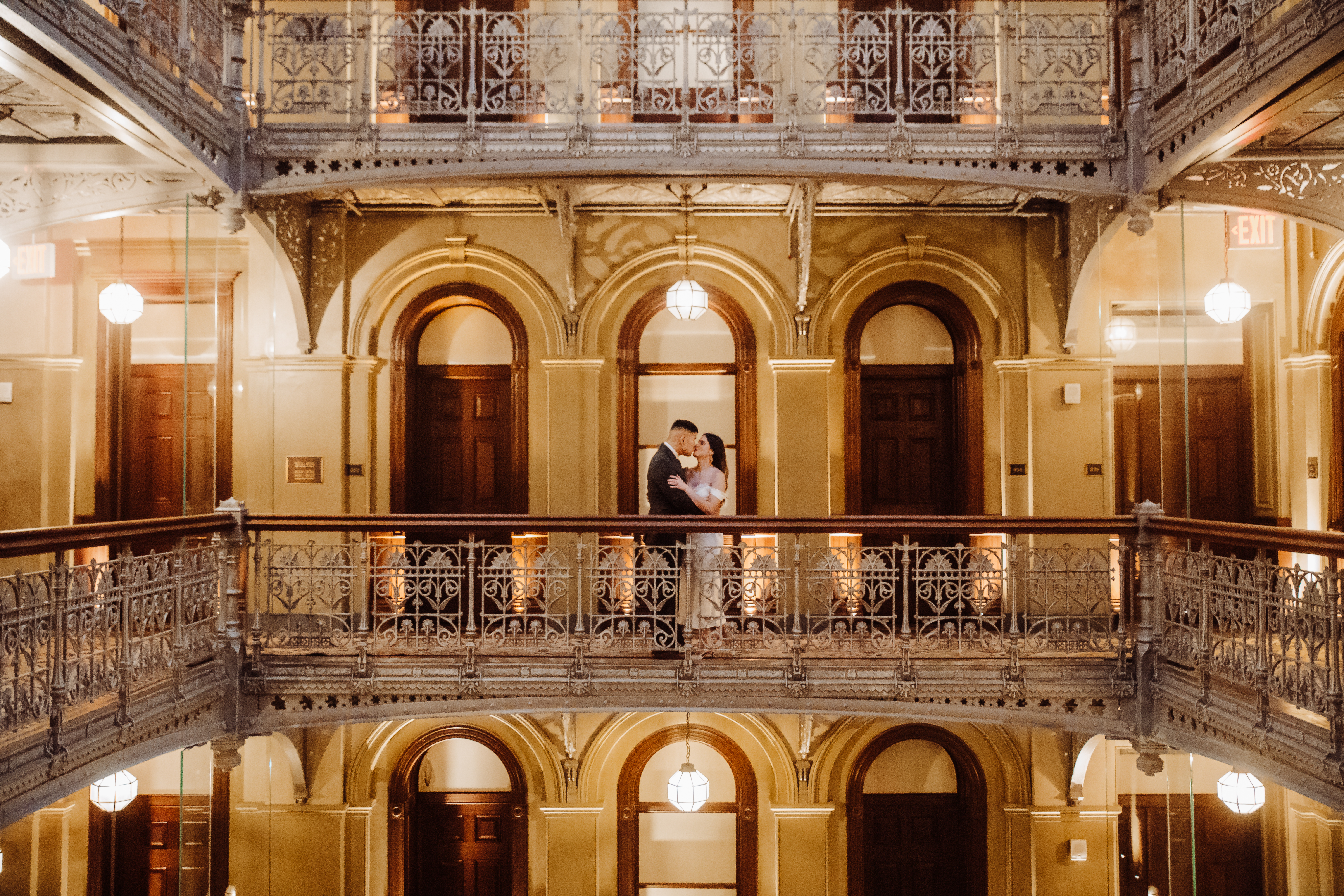 Newlyweds embracing at the Beekman Hotel in NYC,