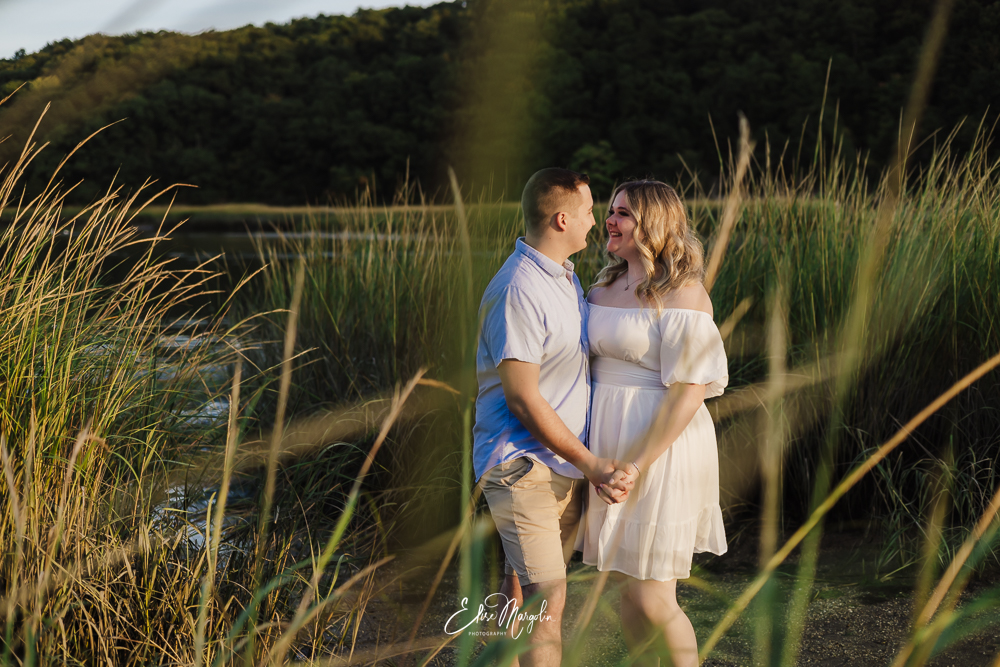 Capturing love and laughter amidst the tall grasses at Sunken Meadow State Park. A dreamy fall engagement session in Long Island's natural beauty